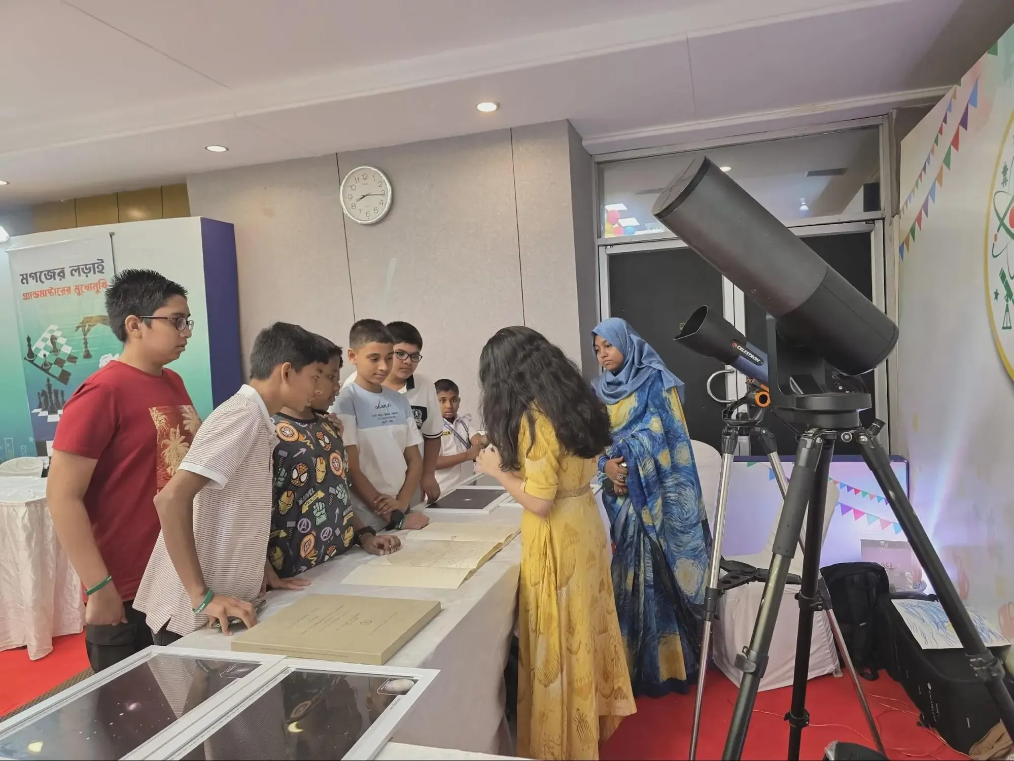 Durbin volunteers explaining the digital telescopes